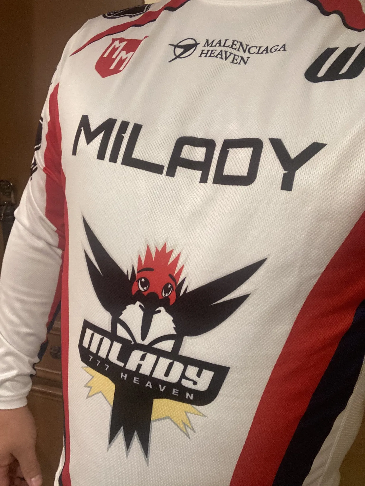 Community member with Mi777 jersey and sticker